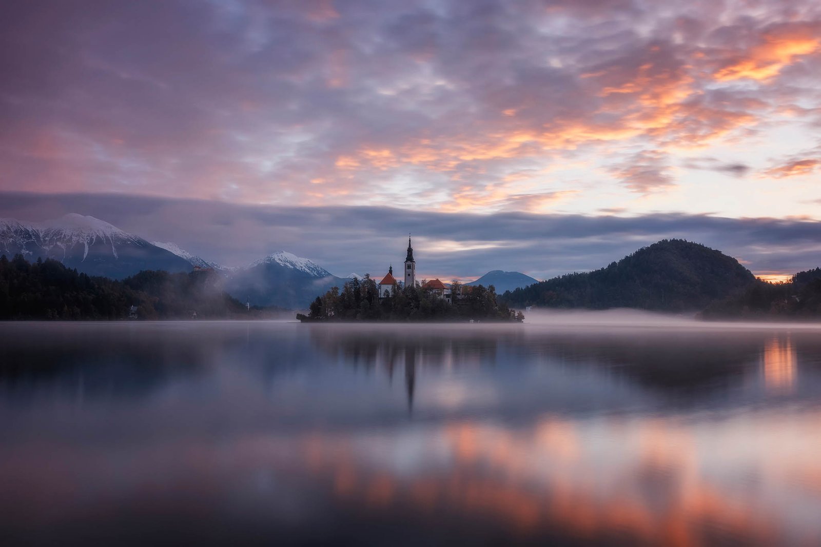 Lake Bled in Slovenia at sunrise. One of many beautiful churches in Slovenia to photograph.